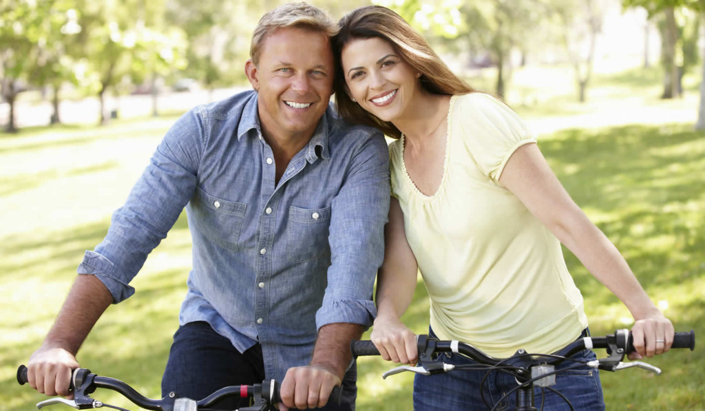 Couple enjoying a summer day on their bikes, London City Mortgages