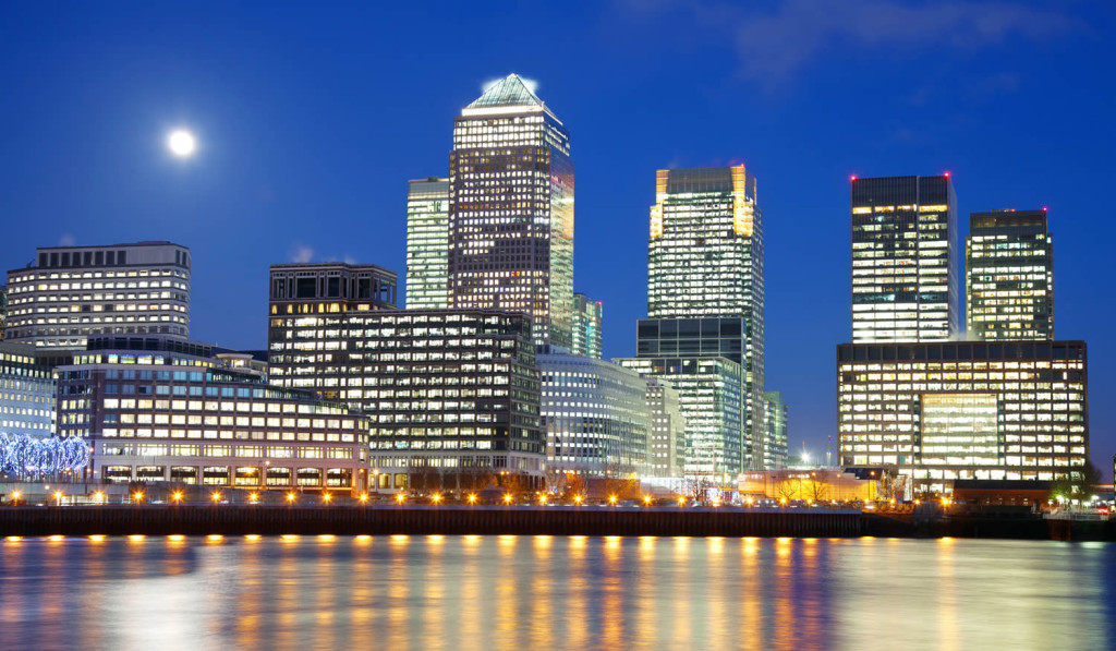 Full moon over Canary Wharf skyline looking east, London City Mortgages