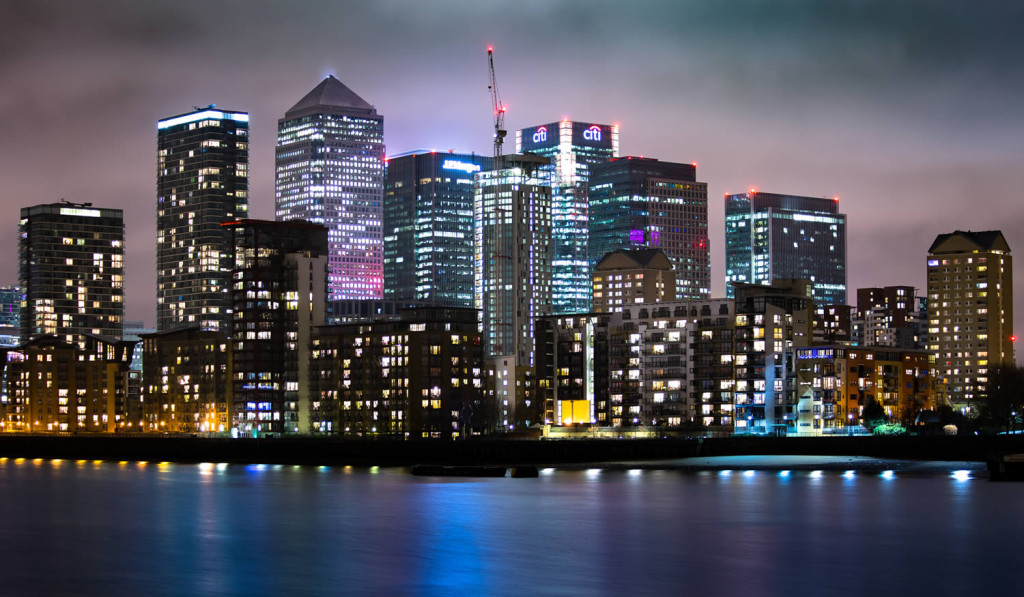 Skyline at night of riverside apartment blocks and Canary Wharf, London City Mortgages