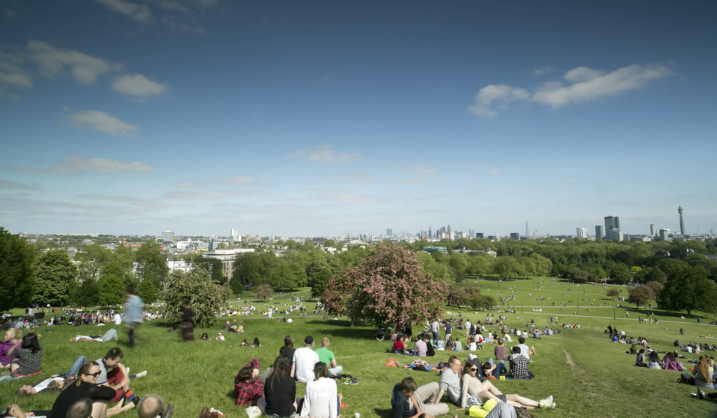 People enjoying sunny day on Primrose Hill and views, London City Mortgages