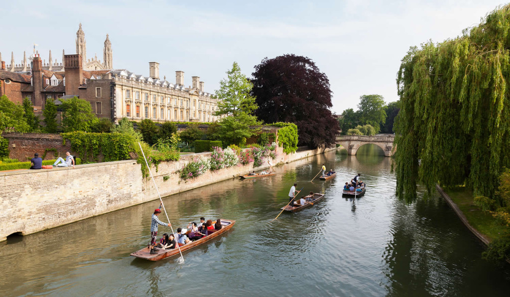 People in punts on river Cam by Clare bridge Cambridge near London City Mortgages