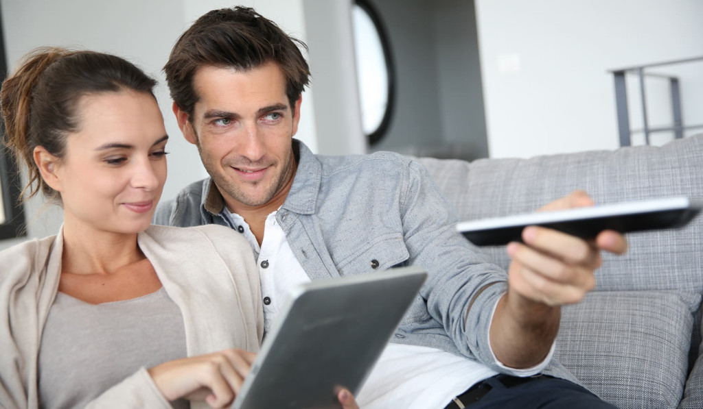 Couple- enjoying comfortable livingroom London City Mortgages