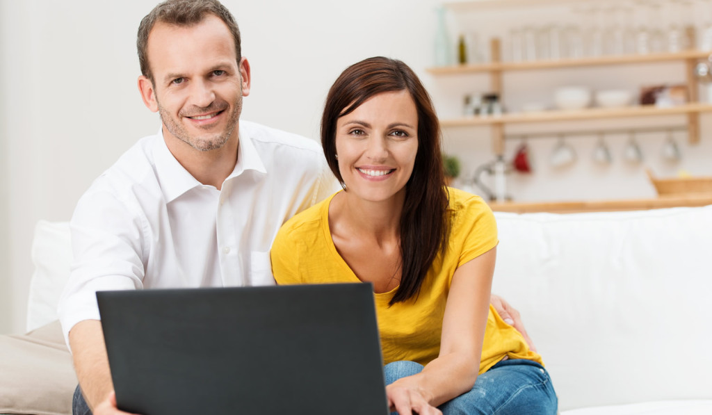 Openplan home couple reviewing laptop London City Mortgages