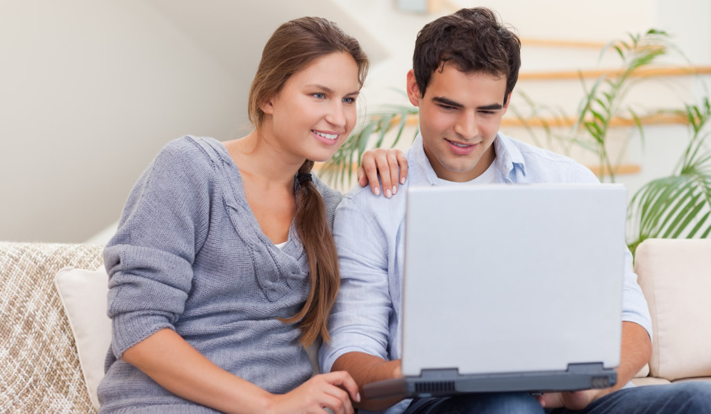 Young couple apartment on laptop London City Mortgages