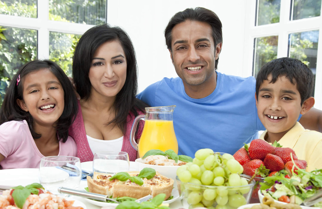 Family having lunch garden extension London City Mortgages